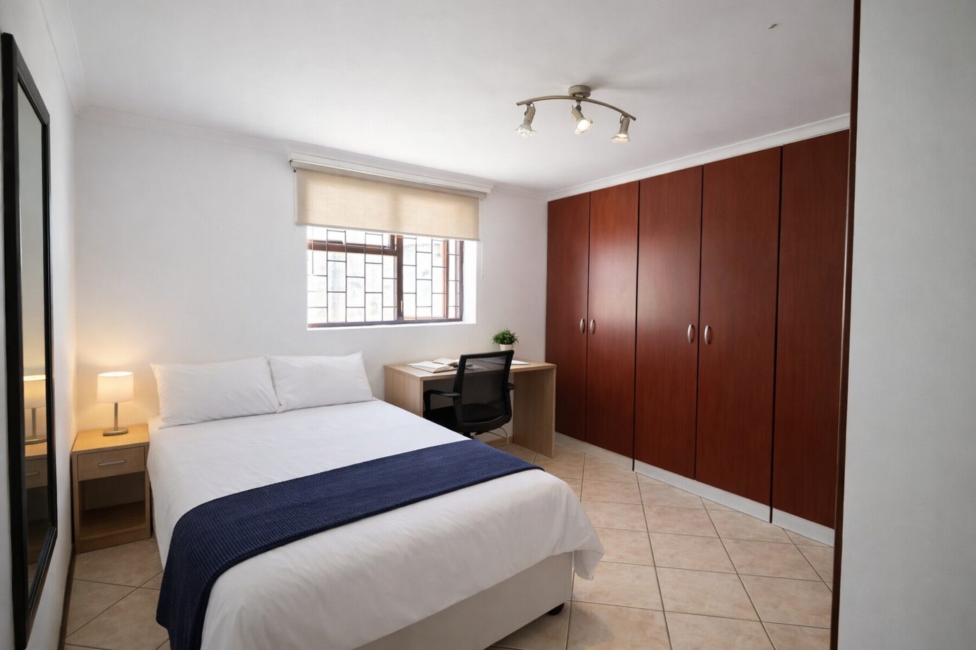 Bedroom with built-in wardrobes at Emerald Arc
